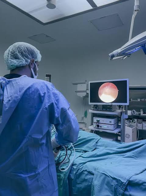 Doctor performing a minimally invasive gynaecological procedure